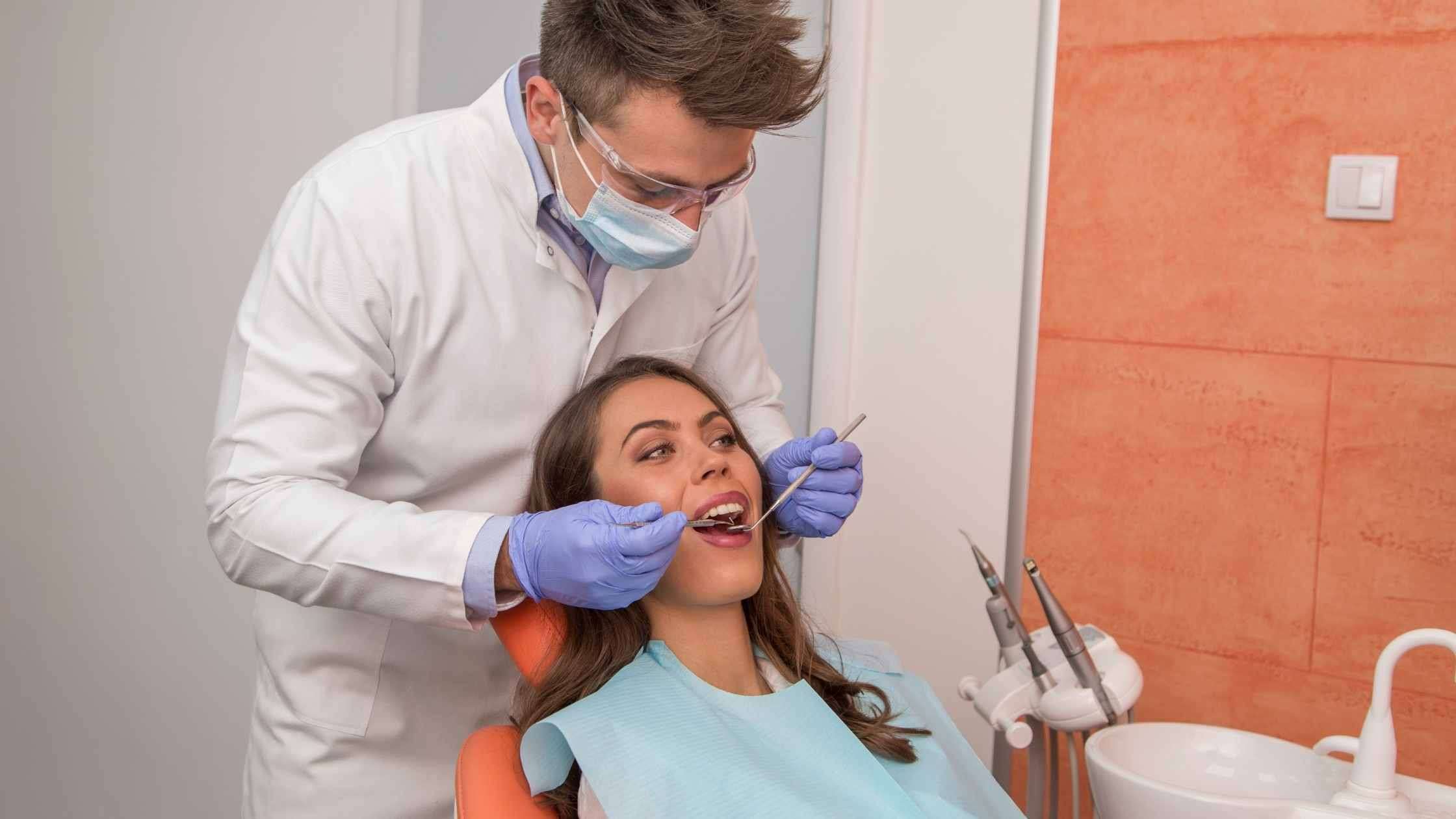 Eaxamining a patient with Dentophobia